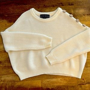 Polly ester sweater with button detail on shoulder